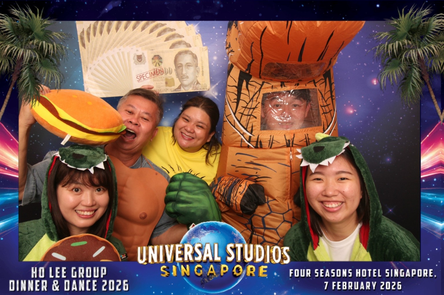 Guests with dinosaur costumes and colourful props in Ho Lee Group’s 2026 dinner and dance print